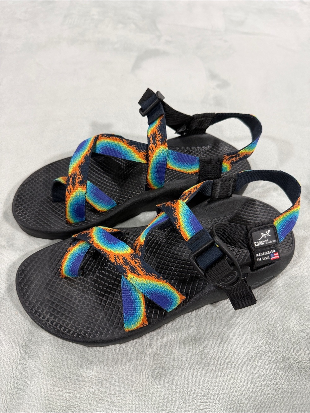 Chaco Adult Adjustable Sandals with Rainbow Orange-Blue Straps on Black